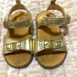 Carter’s size 5 toddler gold sandals with Velcro closure